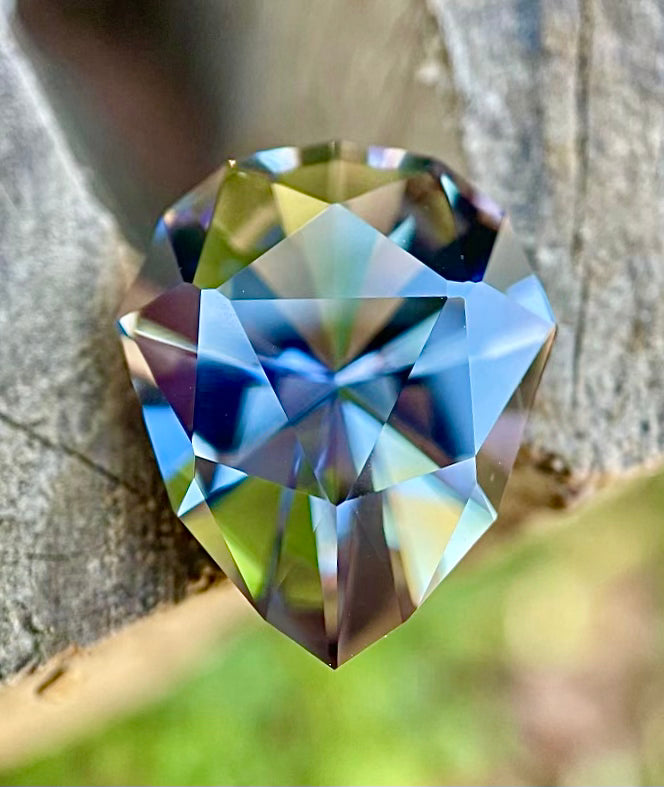 Unheated Tanzanite gemstone — teal, violet, and mermaid hues — ethically sourced from Merelani Hills.