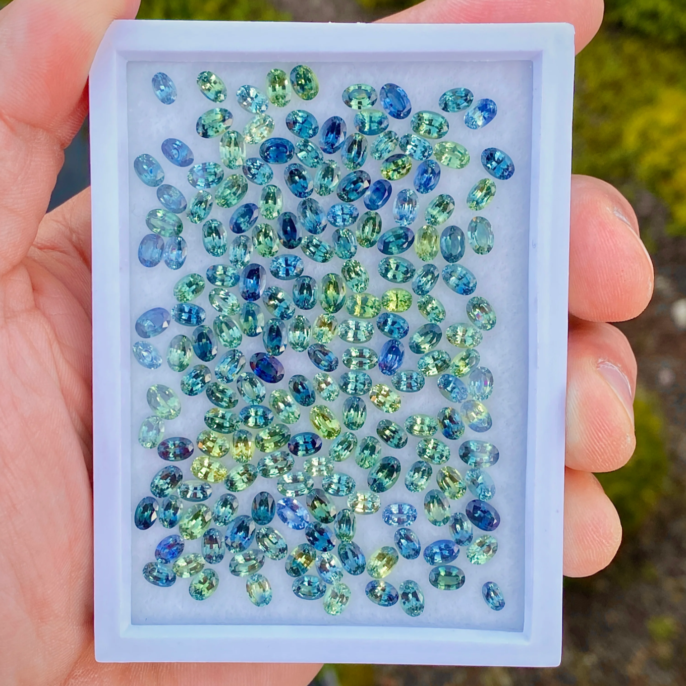 Wholesale gemstone parcel — mixed sapphires, spinel, and tourmaline — ethically sourced by CBQ International.