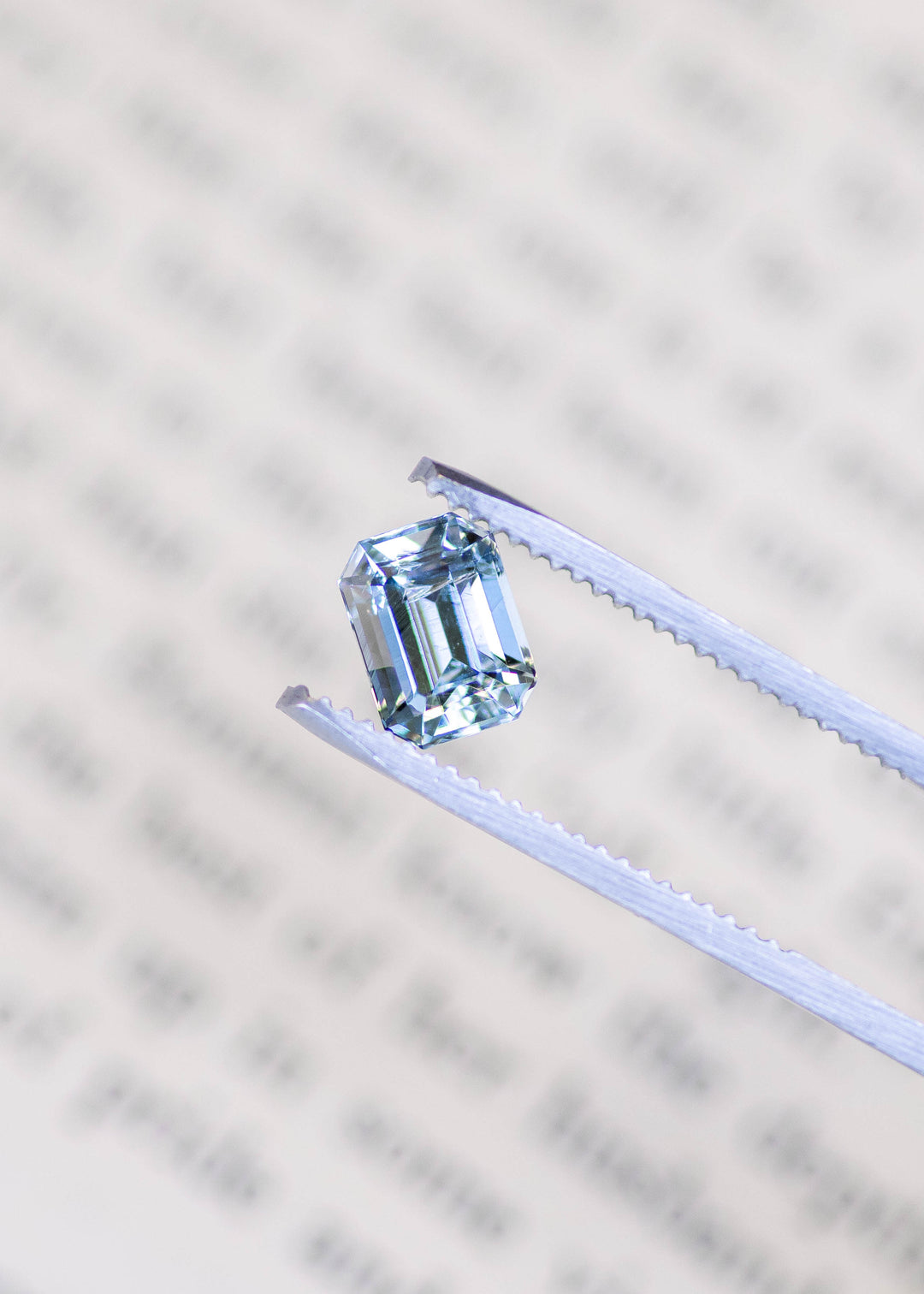 Close-up of a 1.45 carat untreated Colorado aquamarine showing crisp octagonal step facets, exceptional transparency, and soft baby blue color.