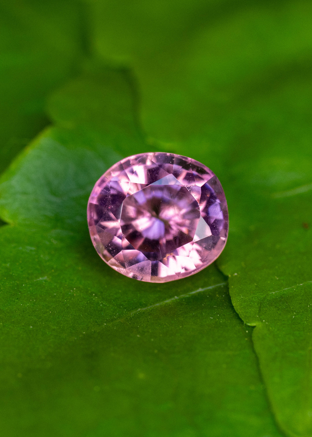 Untreated 1.64 carat natural pink tourmaline from Congo in a custom antique radiant round cut displaying vibrant rosy pink brilliance.