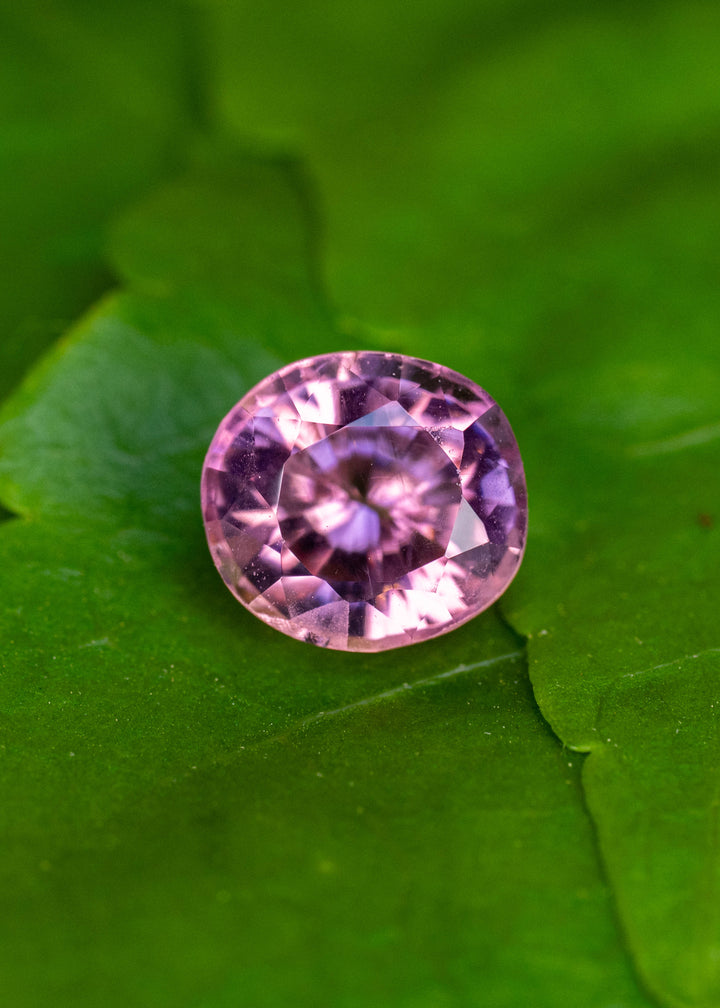 Untreated 1.64 carat natural pink tourmaline from Congo in a custom antique radiant round cut displaying vibrant rosy pink brilliance.
