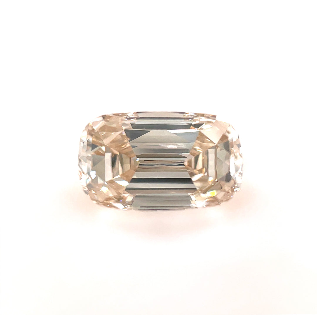 High-resolution image of a 1.03ct fancy yellowish brown diamond, showcasing its step-cut cushion shape and VS2 clarity, displayed on a white background.