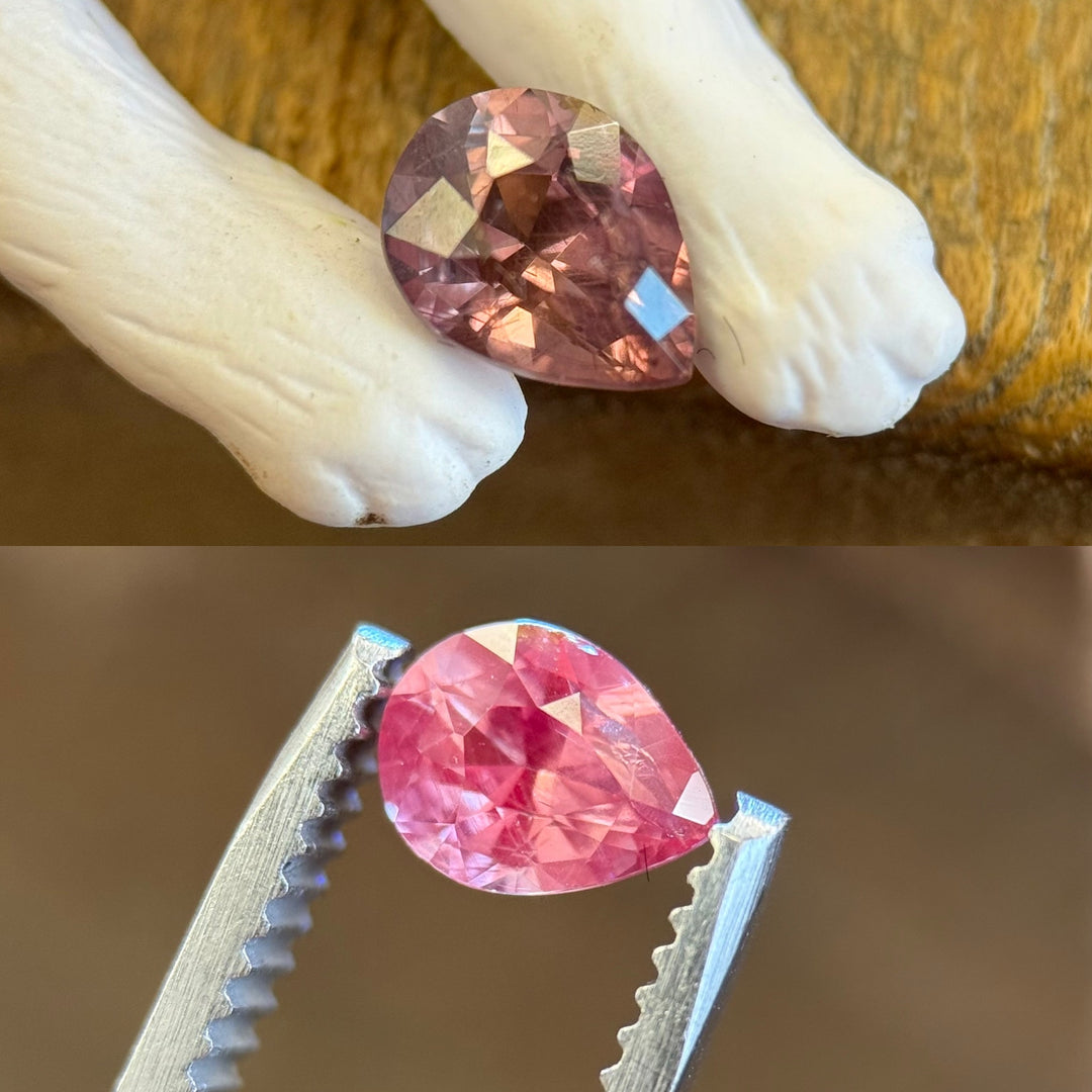 Color-shifting pear cut sapphire from Tanzania showing mauve red and hot pink tones in natural lighting