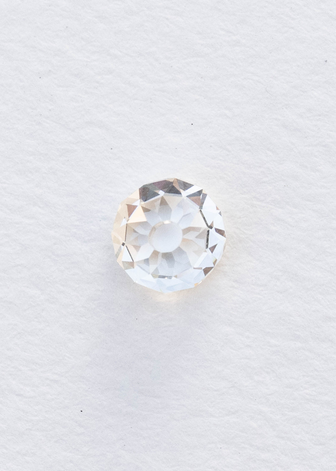 1.06 carat round Mughal cut South African diamond photographed face-up on white, showing its symmetrical circular outline, open central table and radiating broad facets.