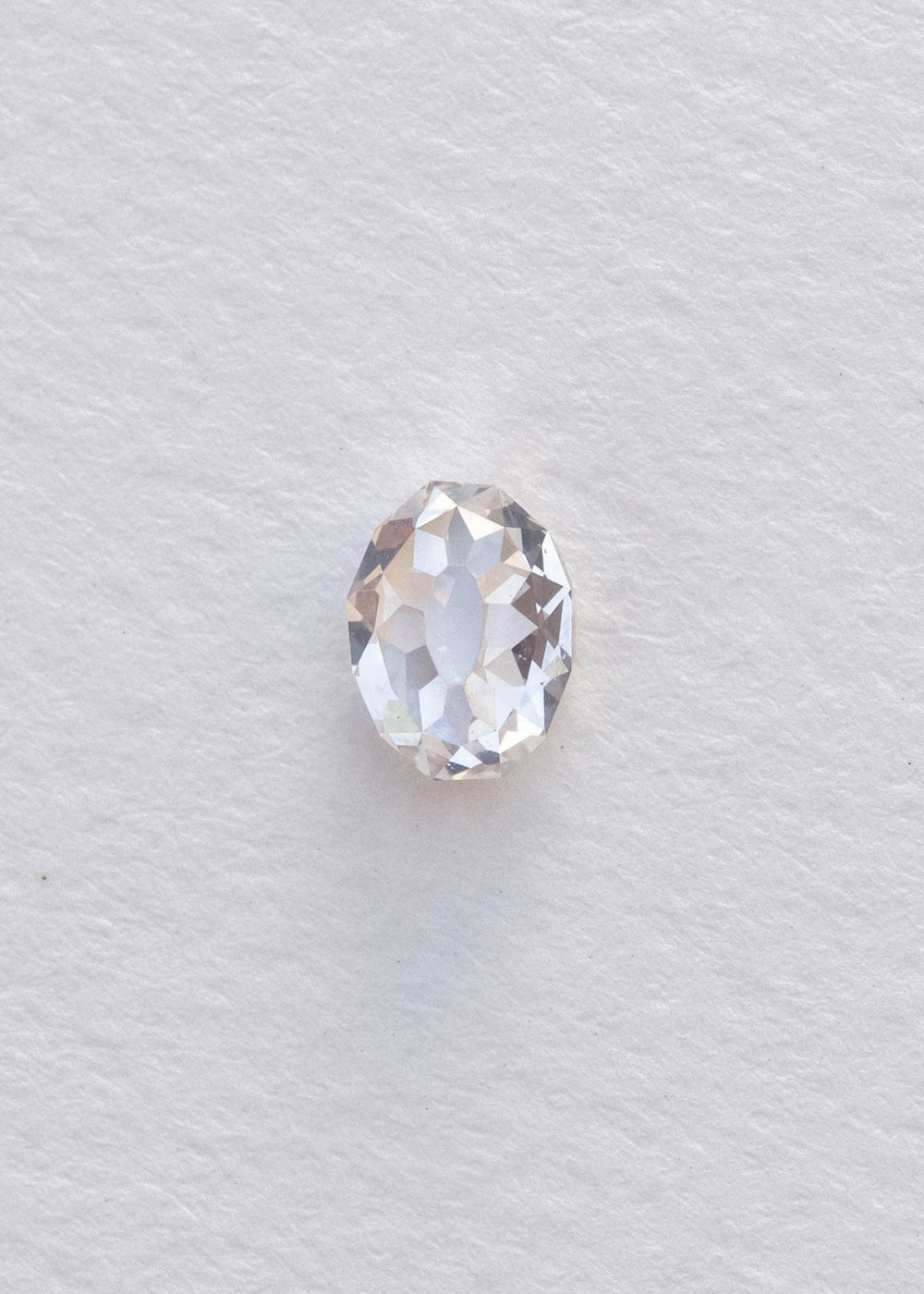 Face-up 1.08 carat oval Mughal cut diamond photographed on white, clearly showing the elongated central table and surrounding geometric facet arrangement.
