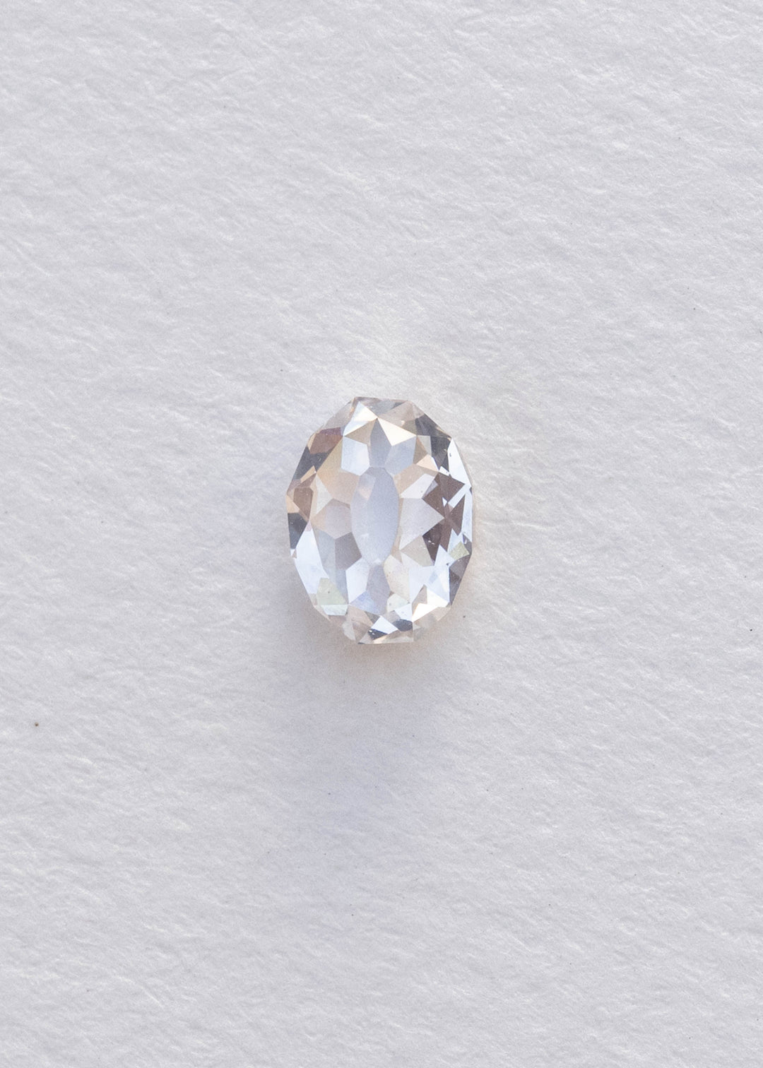 Face-up 1.08 carat oval Mughal cut diamond photographed on white, clearly showing the elongated central table and surrounding geometric facet arrangement.