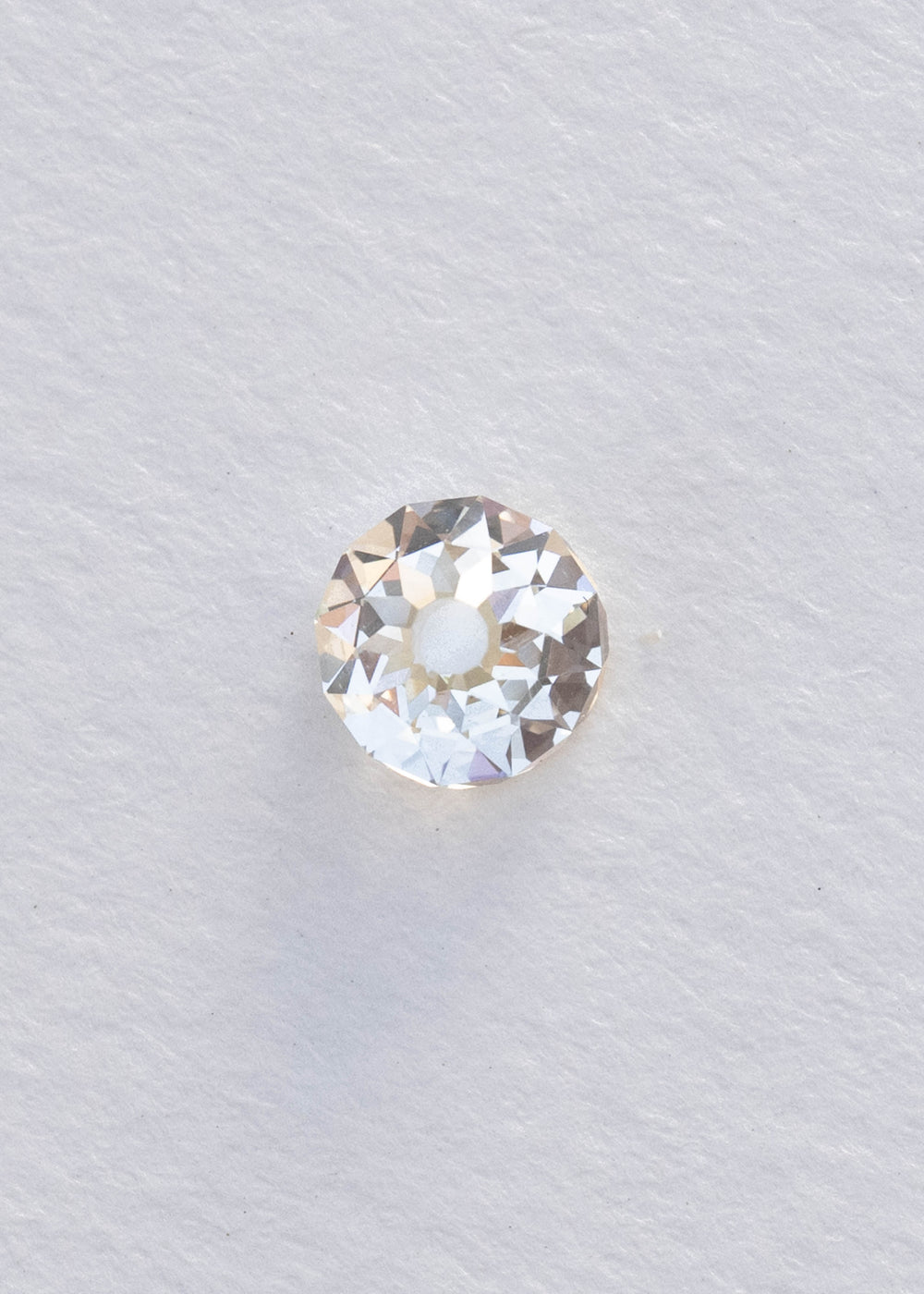 Face-up 1.09 carat South African diamond on a white background, clearly showing its near-round silhouette, broad central table and irregular Mughal-style faceting.