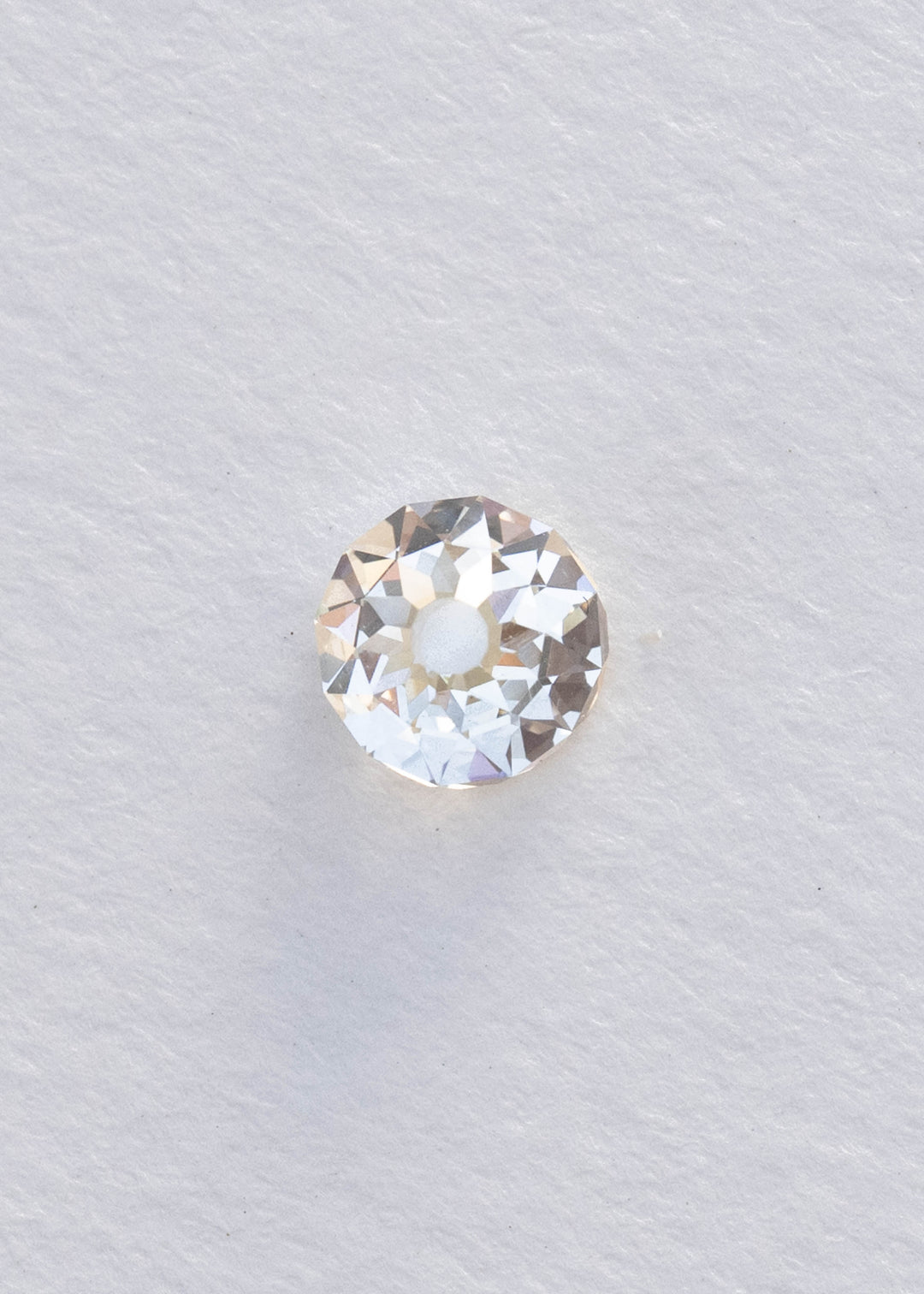 Face-up 1.09 carat South African diamond on a white background, clearly showing its near-round silhouette, broad central table and irregular Mughal-style faceting.