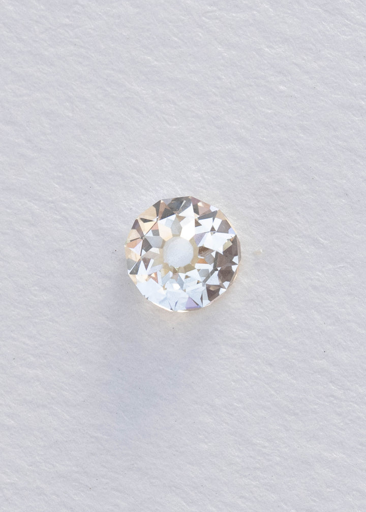 Face-up 1.09 carat South African diamond on a white background, clearly showing its near-round silhouette, broad central table and irregular Mughal-style faceting.
