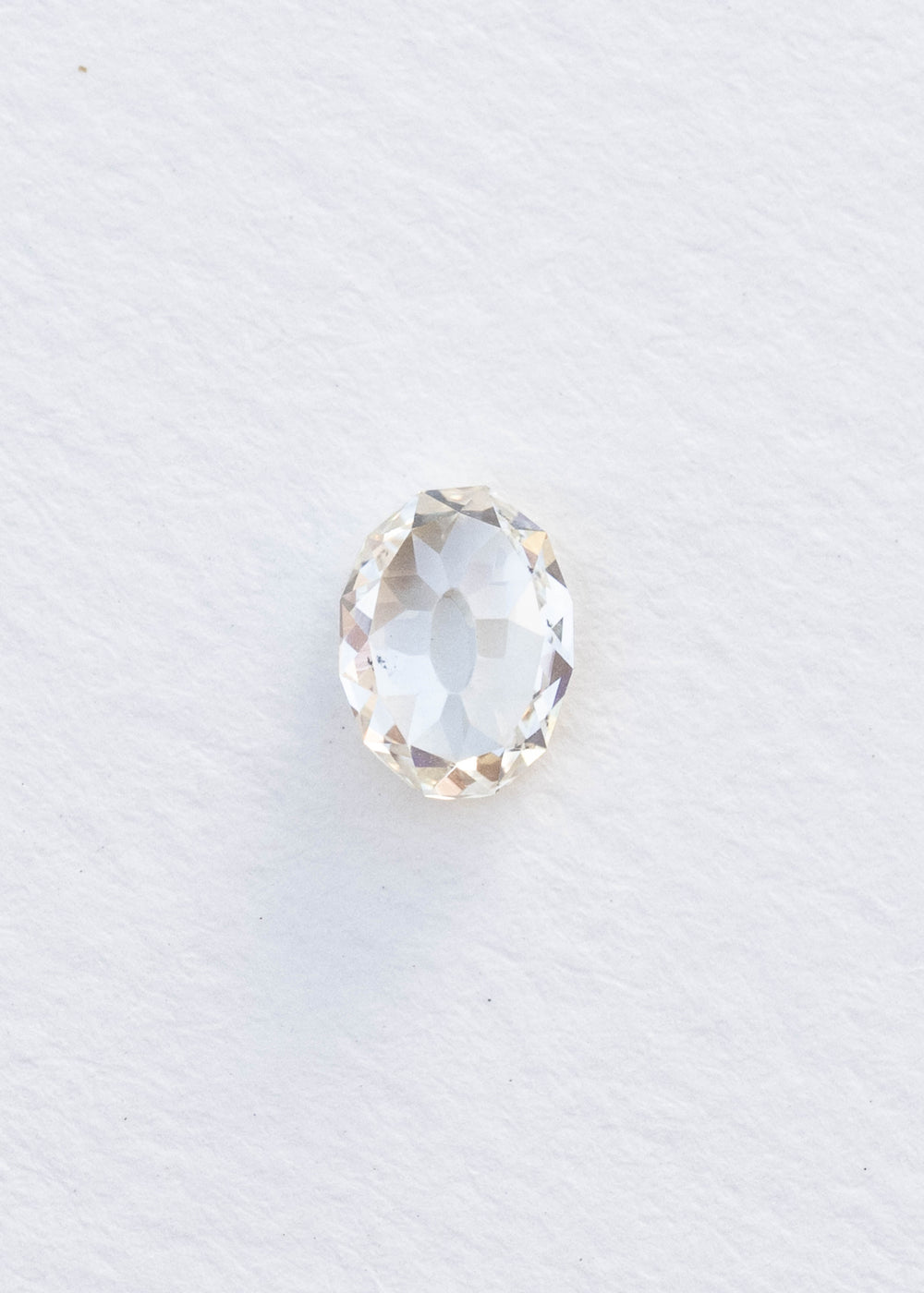 Face-up 1.09 carat oval Mughal cut South African diamond on a white background, showing its elongated outline, open central table and broad irregular facets.