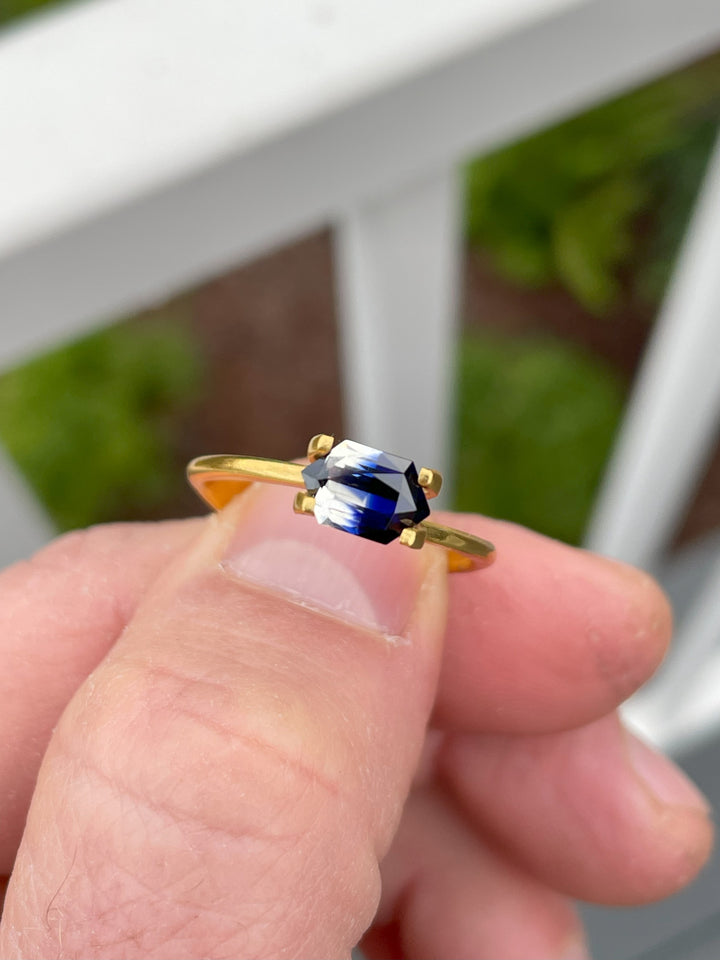1.10-carat bi-color sapphire in a mix brilliant hexagon cut set in a gold solitaire ring.