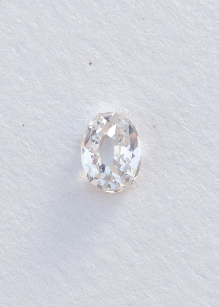 Face-up 1.11 carat oval Mughal cut diamond on white, clearly showing the elongated central table and irregular geometric facets surrounding it.