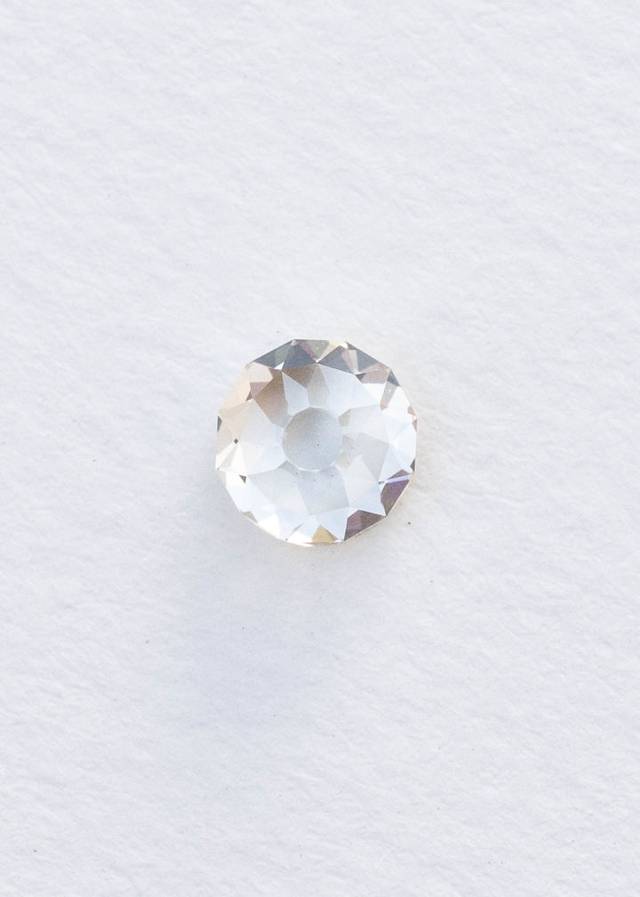 Face-up 1.11 carat round Mughal cut diamond photographed on white, clearly showing the broad central table and irregular geometric facet arrangement.