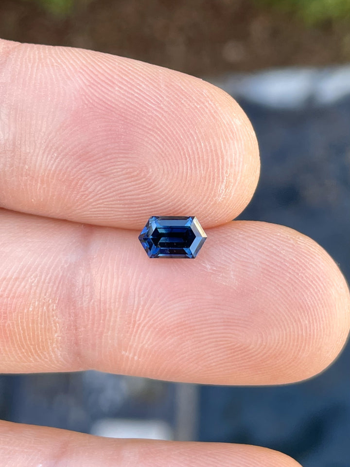 A stunning 1.31-carat sapphire with an octagonal step cut, showcasing deep teal and blue hues. Ethically sourced from Gombe, Nigeria.