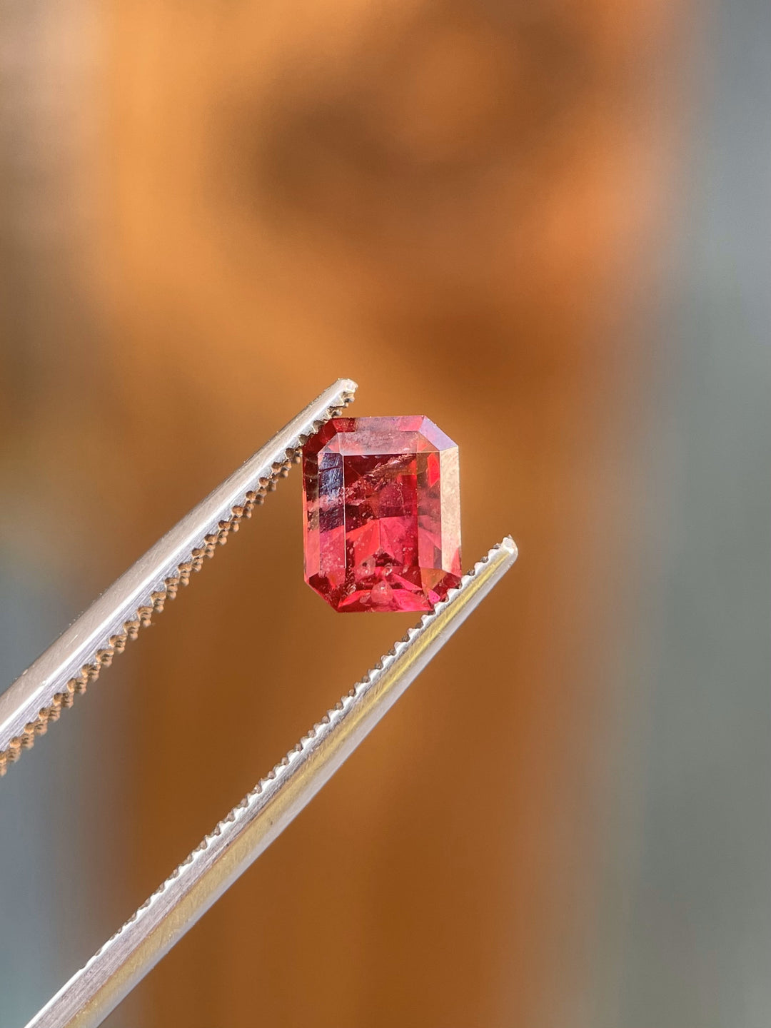 1.36 carat red-pink garnet in a modified octagonal step cut, sourced from Kenya, with dimensions of 6.87mm x 5.45mm x 3.71mm, untreated, perfect for custom jewelry.
