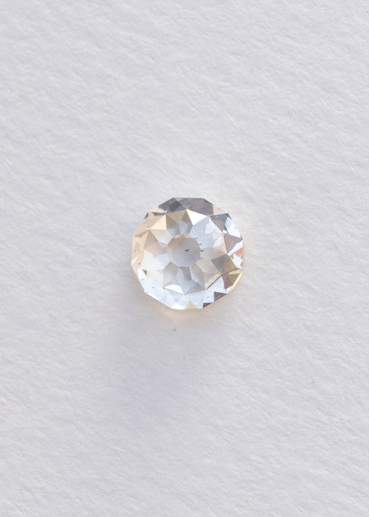 Face-up 1.68 carat Mughal cut diamond on a white background, clearly showing its rounded outline, central table and distinctive radial facet pattern.