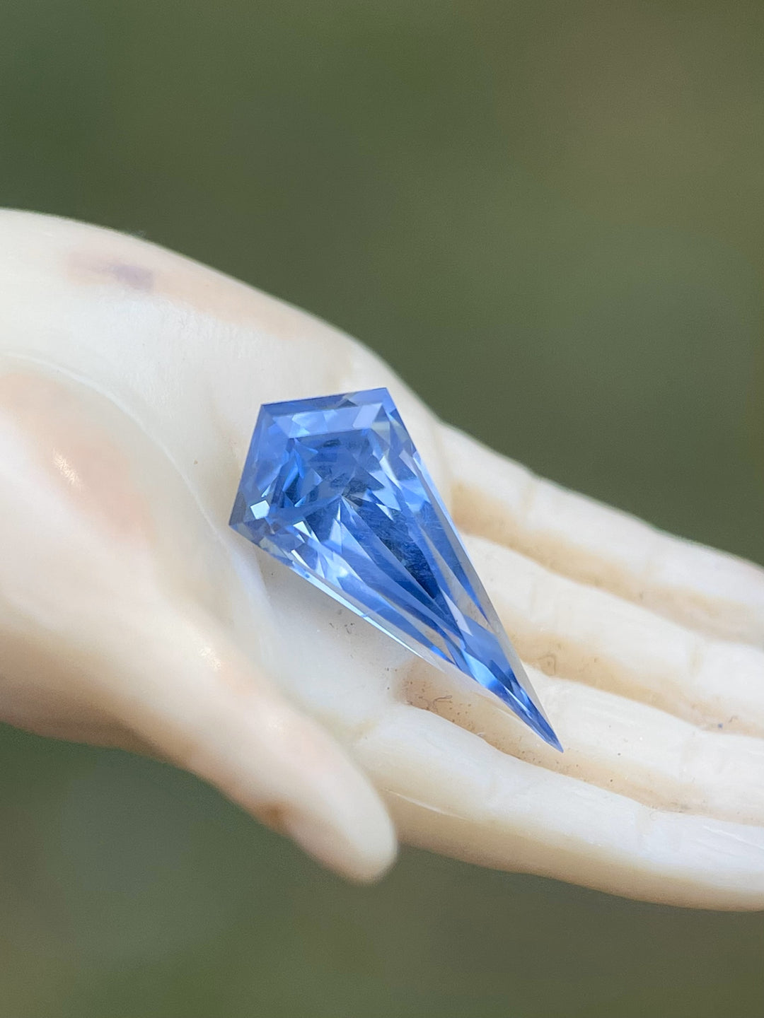 A stunning 1.70-carat powder blue sapphire with a kite step cut. Ethically sourced from Sri Lanka, this untreated gemstone features exceptional clarity and brilliance.