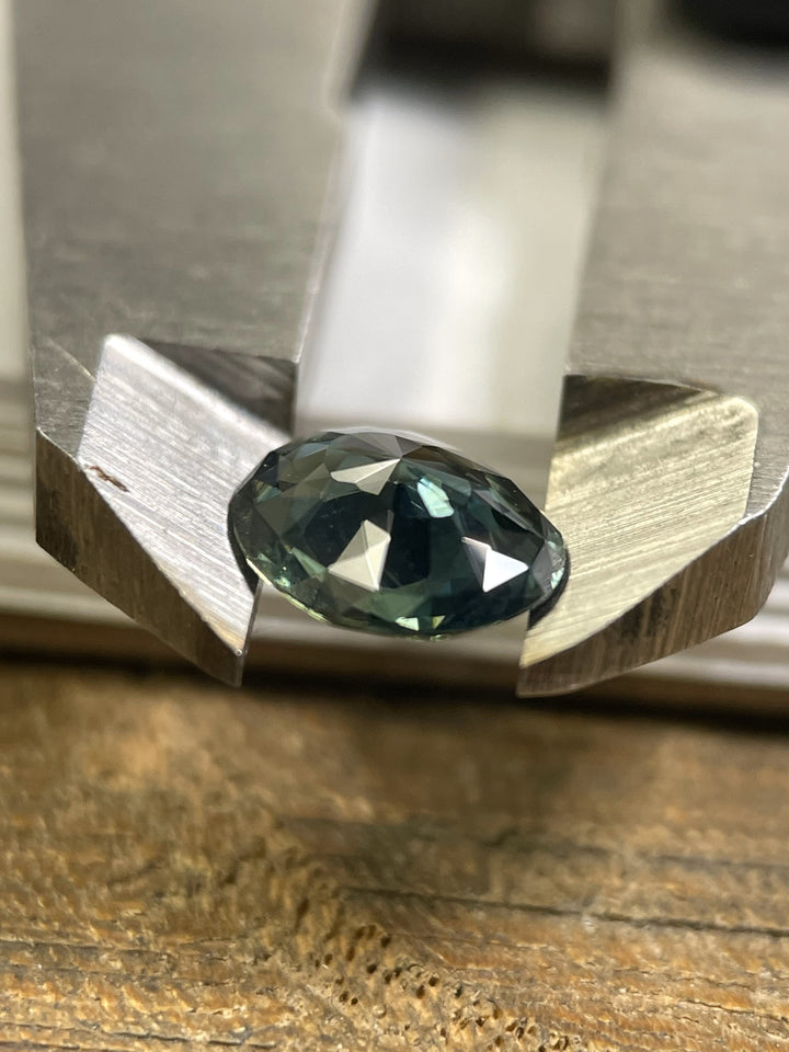 A stunning 1.72-carat sapphire with a mix cut oval shape. Featuring a vibrant mix of green, blue, and teal hues, this gemstone is untreated and ethically sourced from Madagascar.