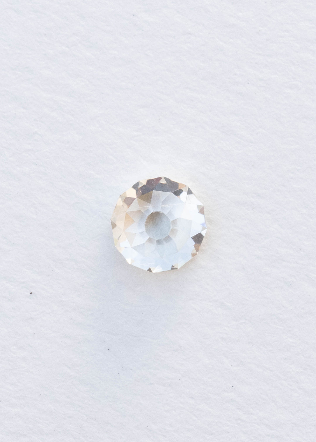 Face-up 1.92 carat round Mughal cut South African diamond on a white background, showing its nearly circular outline, open central table and broad antique-style facets.