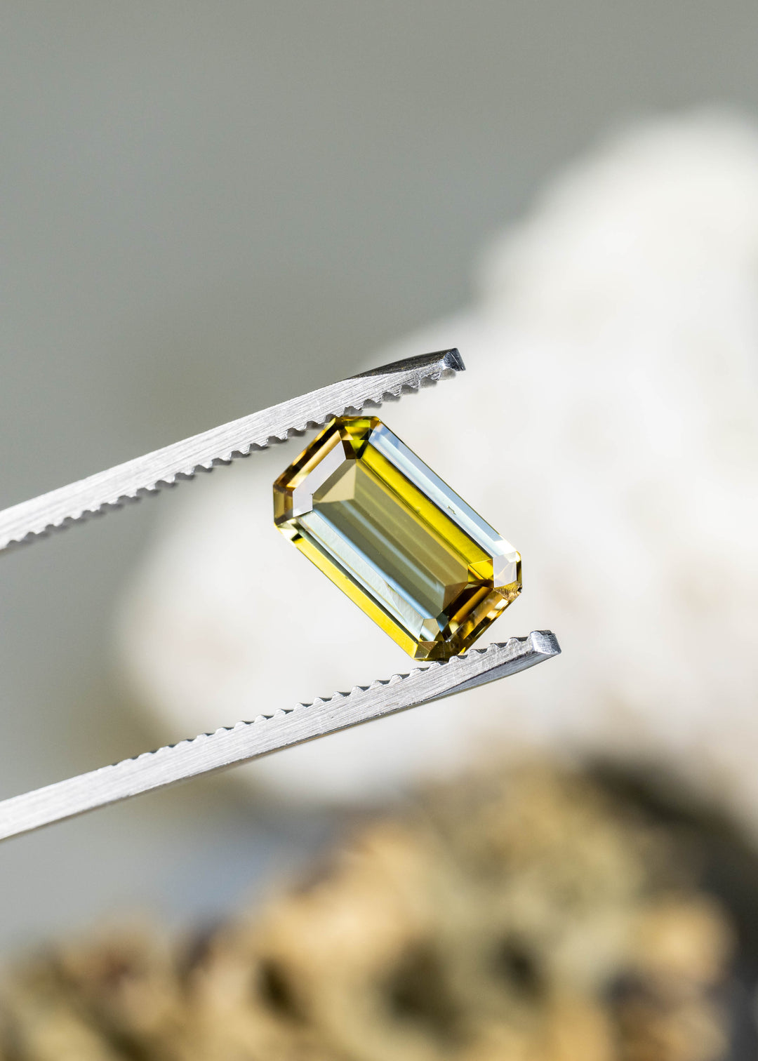 Close-up of an untreated yellow-green tanzanite showing its precision geometric faceting and exceptional clarity.
