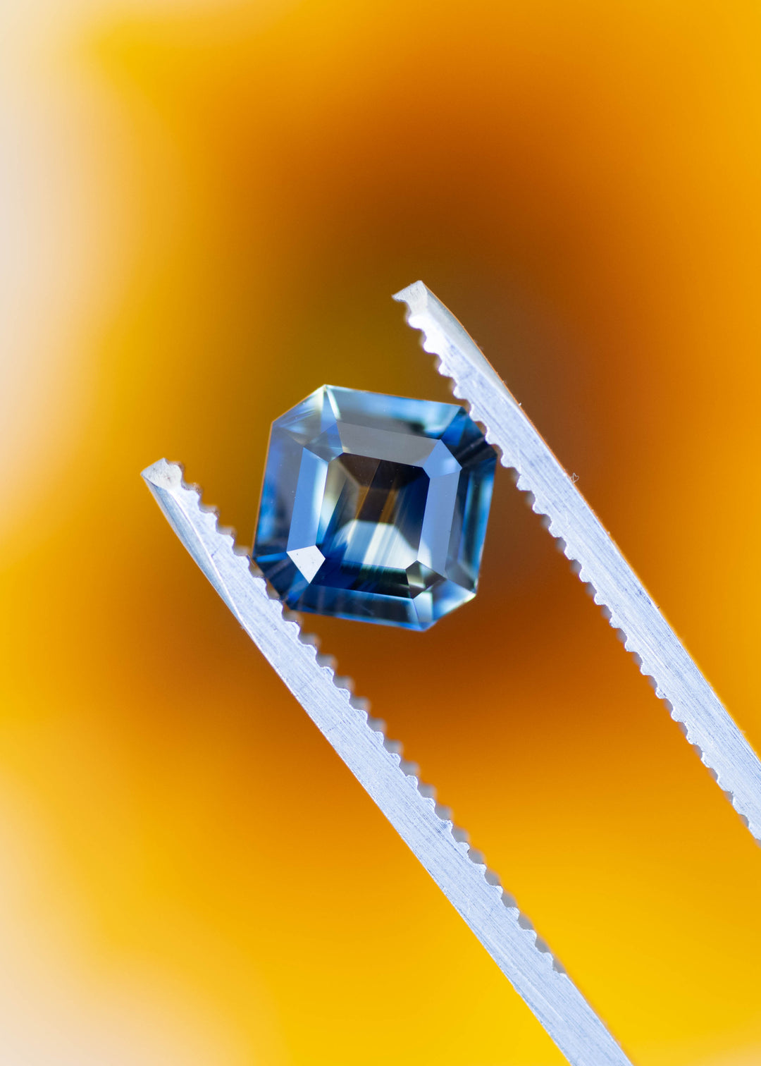 Natural unheated Madagascar parti sapphire Asscher cut showing blue and green color zoning