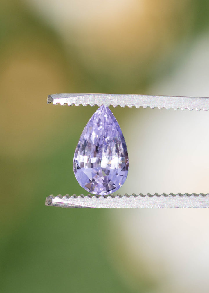 Precision pear cut lavender sapphire from Madagascar close up