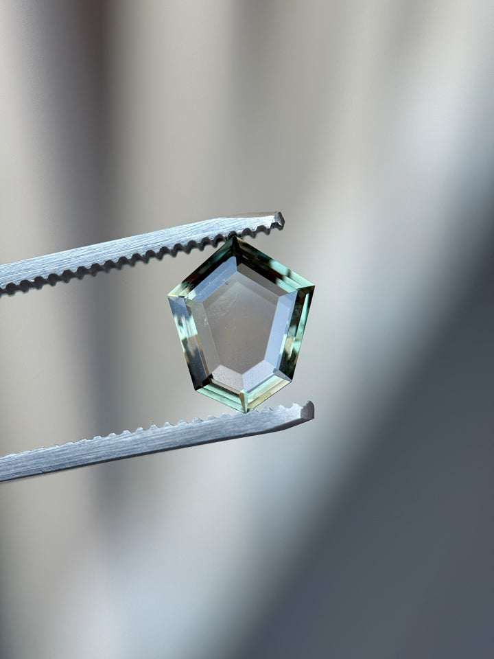 Precision-cut shield portrait sapphire from El Dorado Bar, Montana, with unheated color-changing hues