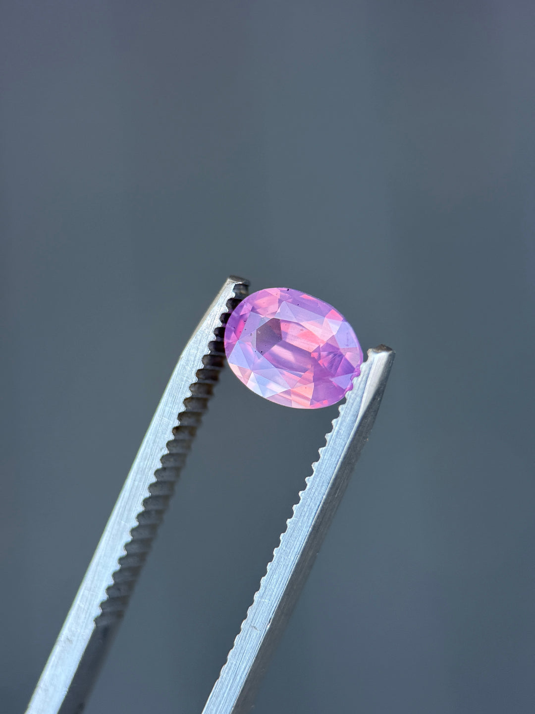 1.52CT Sapphire: Orangish Pink Opalescent Precision Oval Mixed Cut