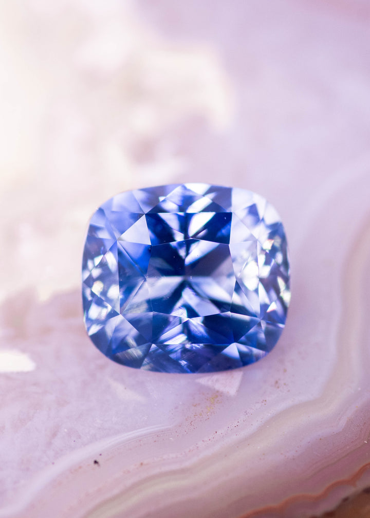 Loose gradient cornflower blue sapphire from Sakaraha Madagascar shown face-up displaying the precision elongated cushion mixed cut and natural blue color gradient.