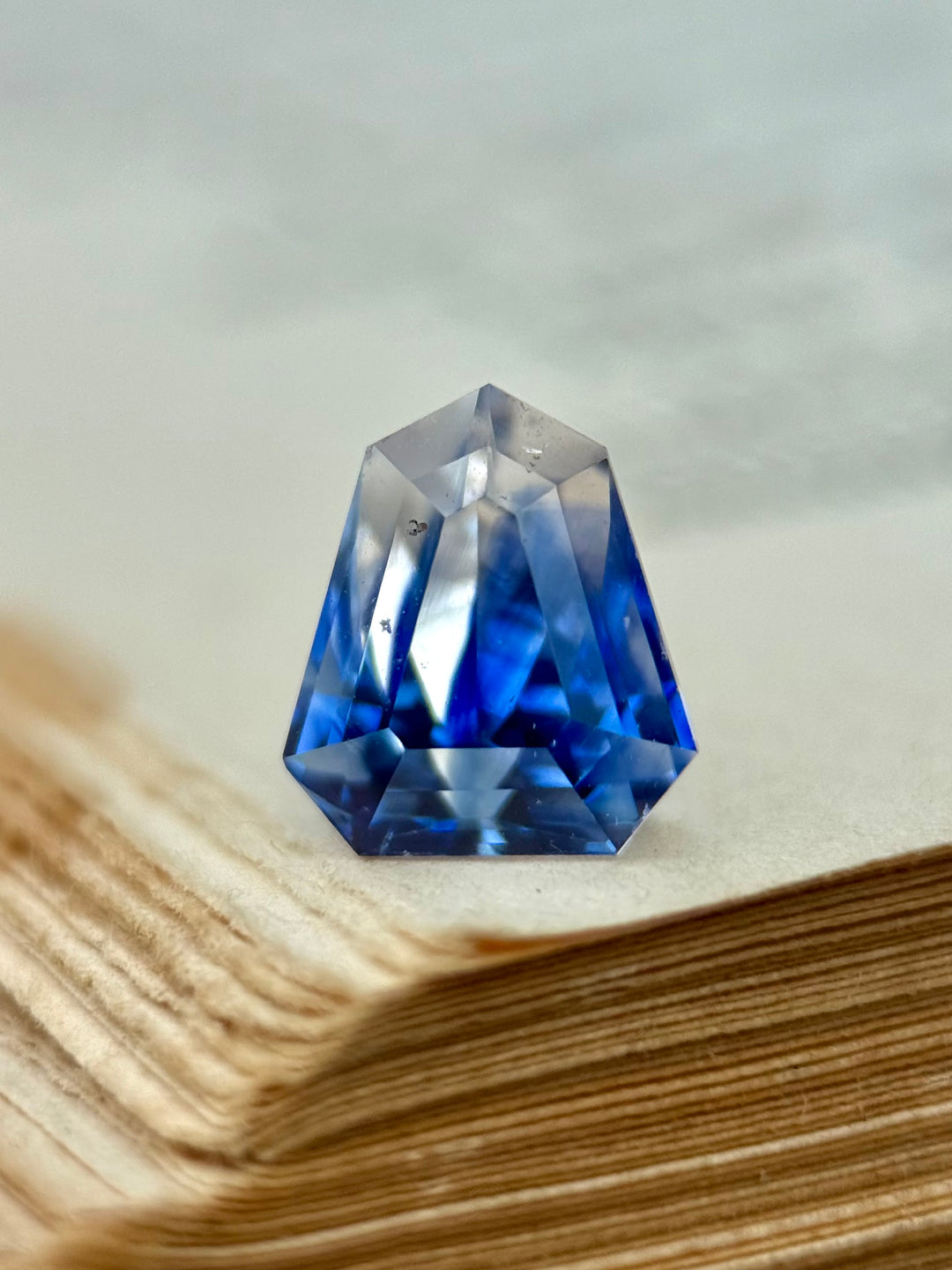 2.42CT Sapphire: Vibid Blue And Colorless Parti Custom Geo Shield Step Cut