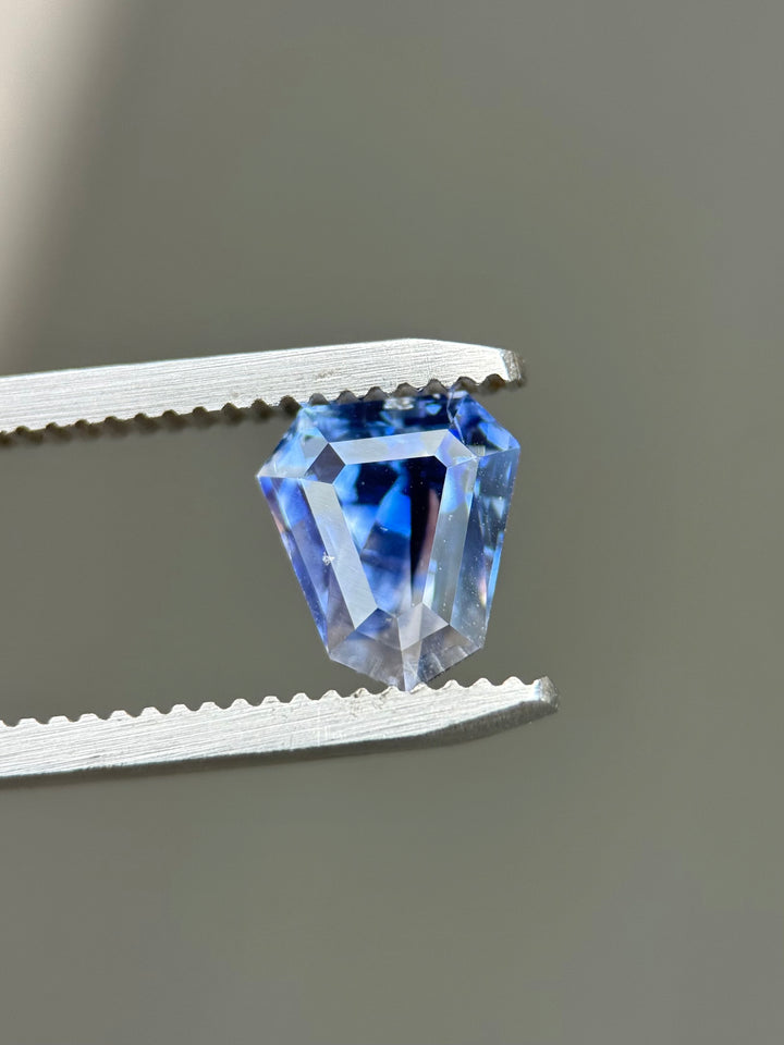2.42CT Sapphire: Vibid Blue And Colorless Parti Custom Geo Shield Step Cut