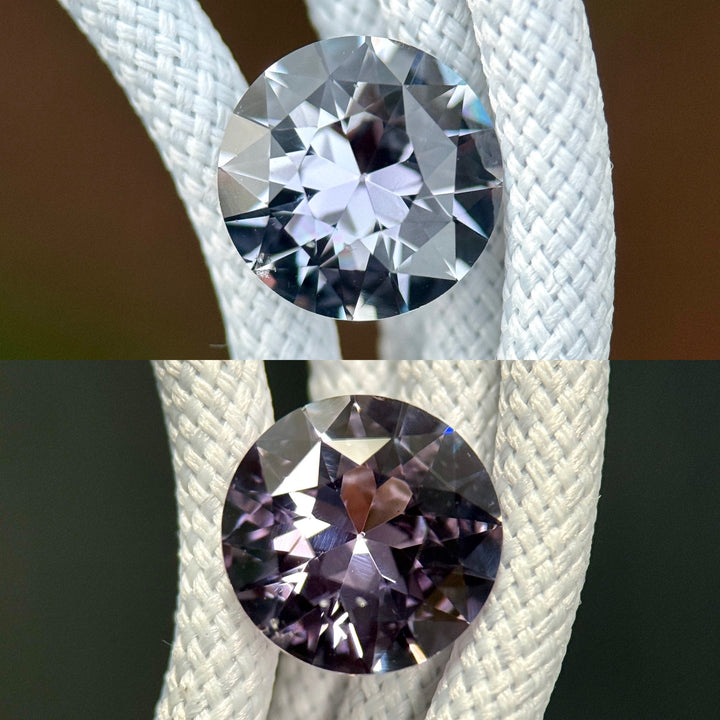 Side-by-side comparison of color-change sapphire displaying grey in daylight and steely violet in low-light conditions, wrapped in white braided cord, 2.60CT antique transitional round cut.
