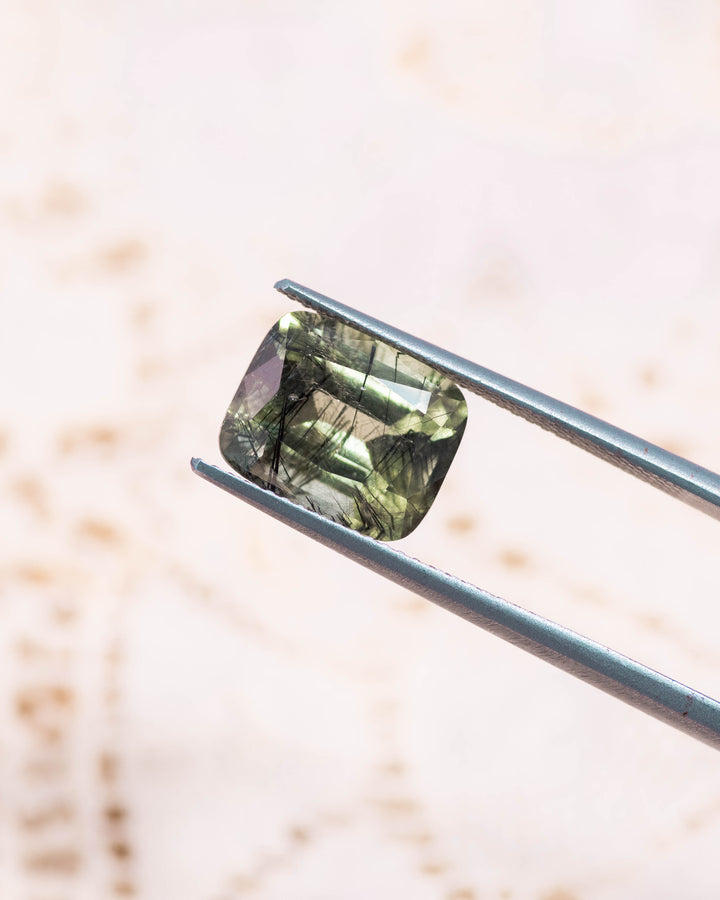 4.76CT Peridot: Green Black Cushion Mix Cut