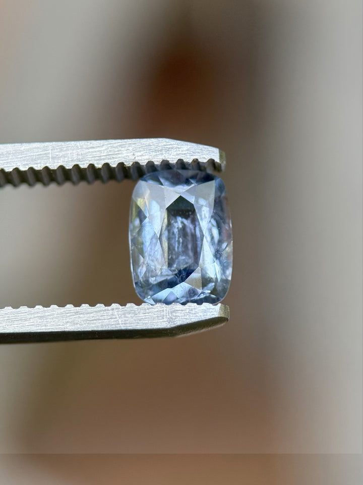 Side profile of 1.33ct powder blue sapphire with custom elongated cushion cut, ethically sourced from Sri Lanka