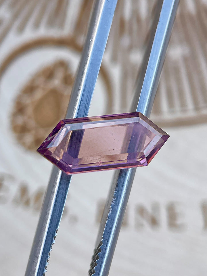 Detailed view of a 1.81 carat Sri Lankan spinel gemstone in a hexagonal step cut, with purple-pink hues and natural untreated clarity.