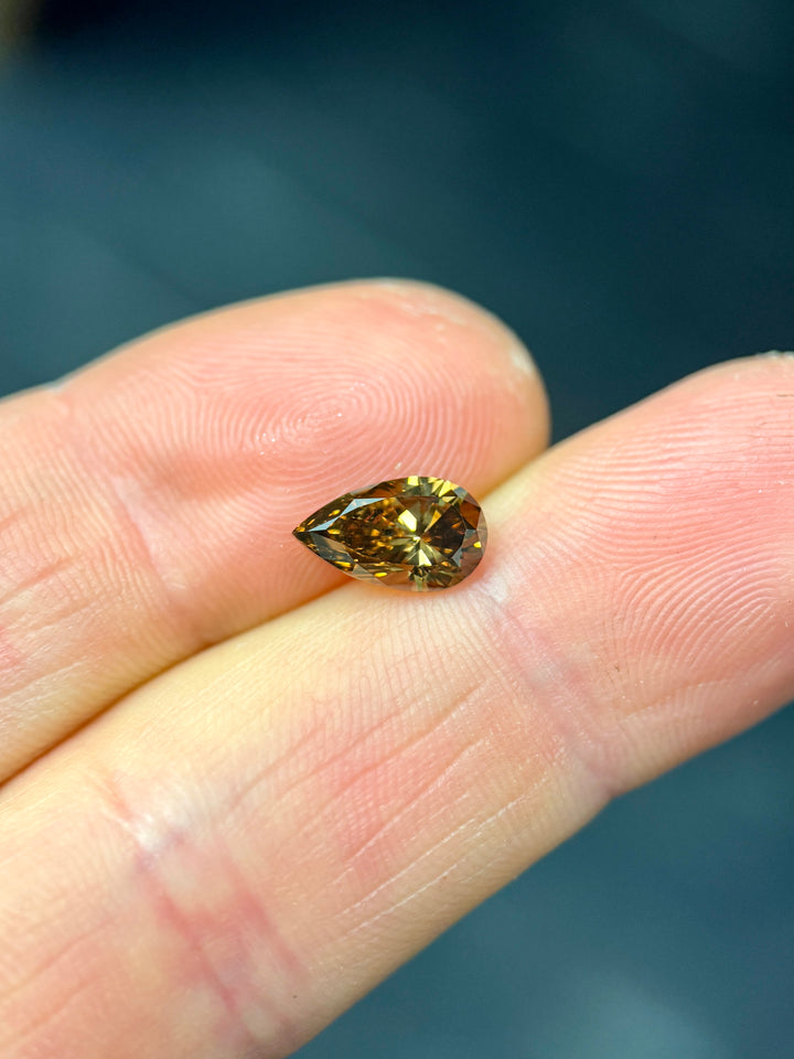 1.65CT Diamond: Fancy Orange Brown Elongated Pear Brilliant With Museum Quality Bi Color Fluorescence