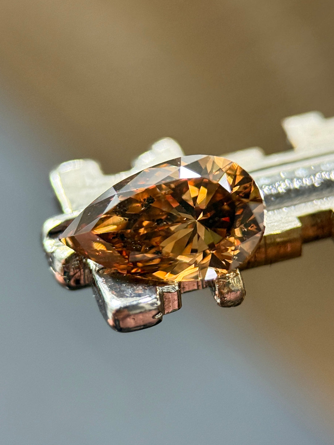 1.65CT Diamond: Fancy Orange Brown Elongated Pear Brilliant With Museum Quality Bi Color Fluorescence