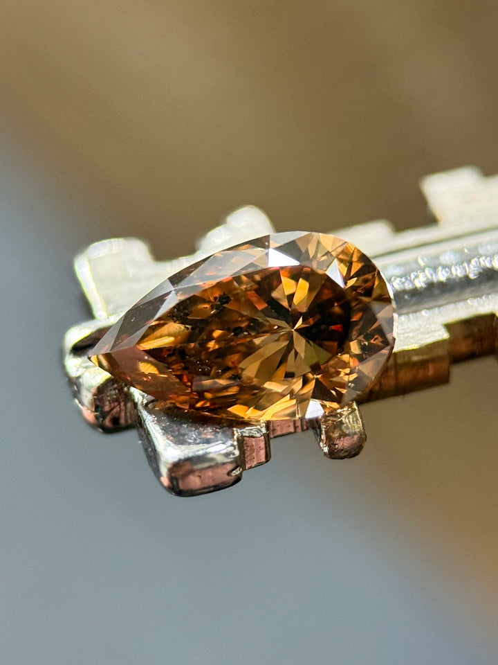 1.65CT Diamond: Fancy Orange Brown Elongated Pear Brilliant With Museum Quality Bi Color Fluorescence