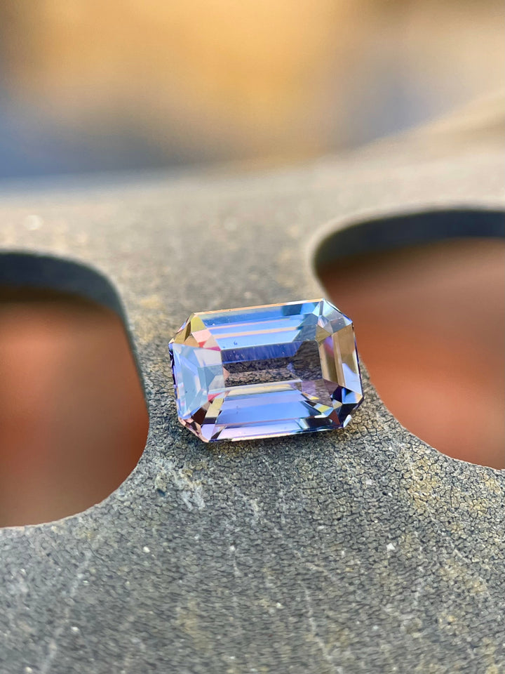 Image of a Precision Emerald Cut Tanzanite Gemstone in Teal Blue and Purple Colors, Weighing 1.70 Carats, with Dimensions 8.49 x 5.85 x 3.98 mm, from Merelani Hills, Arusha Region, Tanzania - No Treatment