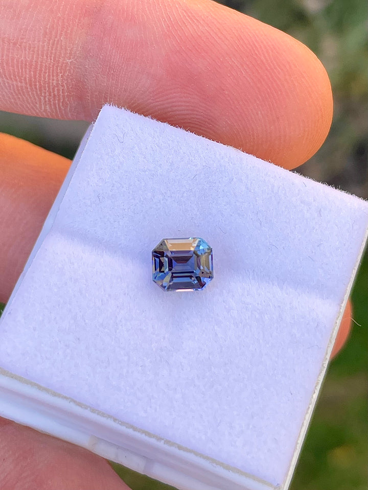 Close-Up Image of a Custom Modified Emerald Cut Tanzanite Gemstone in Teal, Blue, Green, and Purple Colors, Weighing 1.32 Carats, with Dimensions 6.49 x 5.58 x 4.60 mm, from Merelani Hills, Arusha Region, Tanzania - No Treatment
