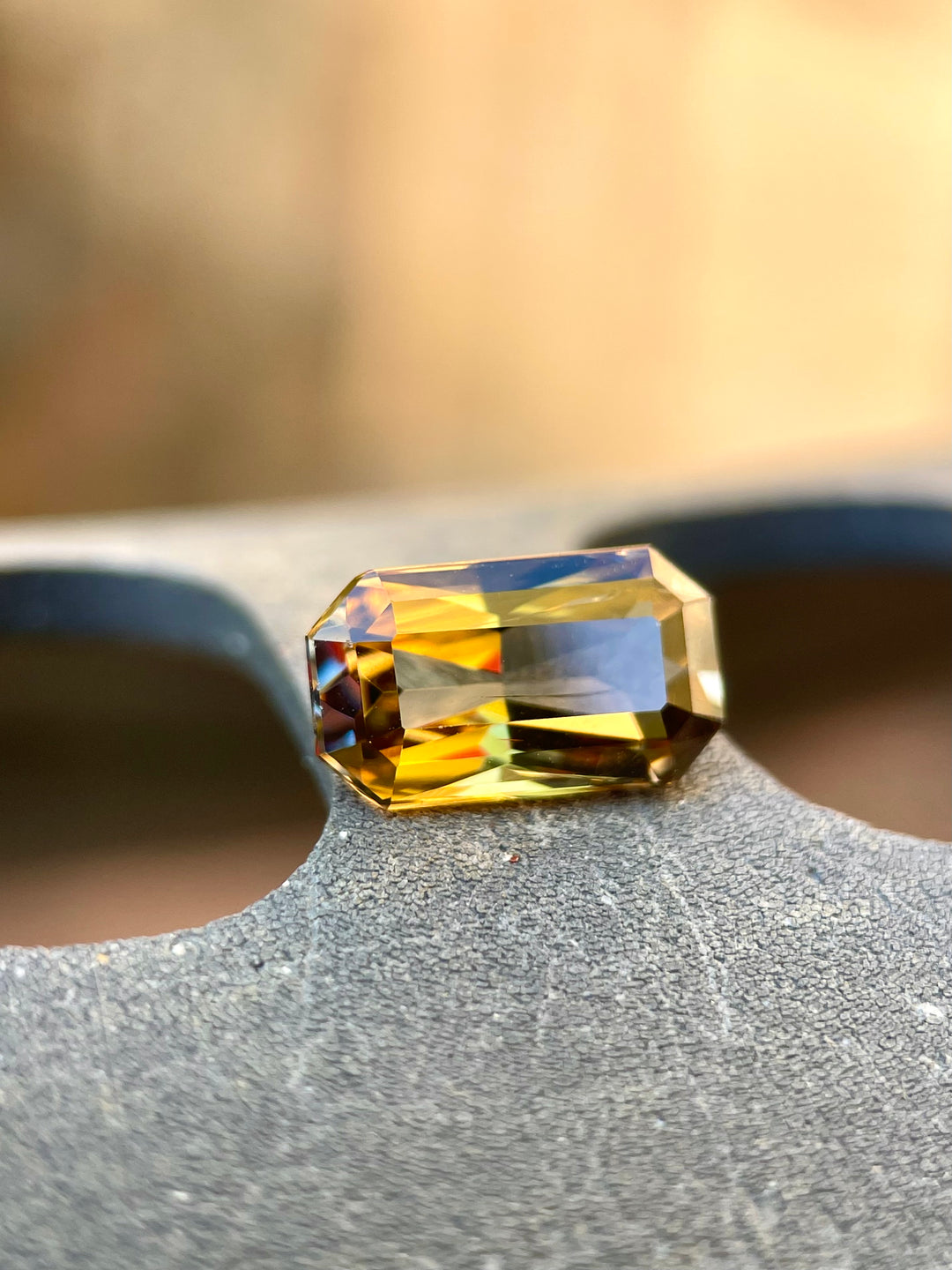 Custom Elongated Radiant Cut Tanzanite Gemstone in Greenish Golden, Peach, and Yellow Colors, Weighing 2.30 Carats, with Dimensions 10.59 x 6.05 x 4.43 mm, Originating from Merelani Hills, Arusha Region, Tanzania - No Treatment