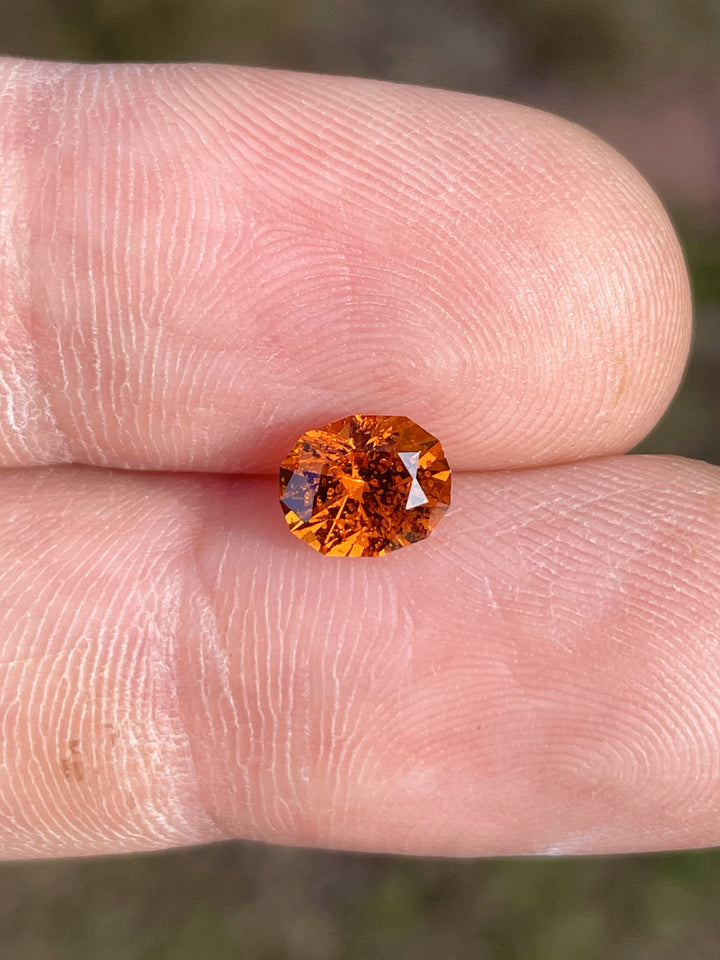 Brilliant oval-cut 1.61-carat Hessonite Garnet in fiery orange-brown, ethically sourced from Kenya.