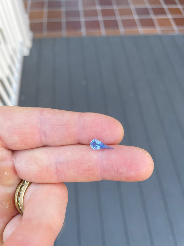 A 1.70-carat sapphire with a kite-shaped step cut, showcasing a delicate powder blue hue. Ethically sourced from Sri Lanka and untreated for a natural finish.