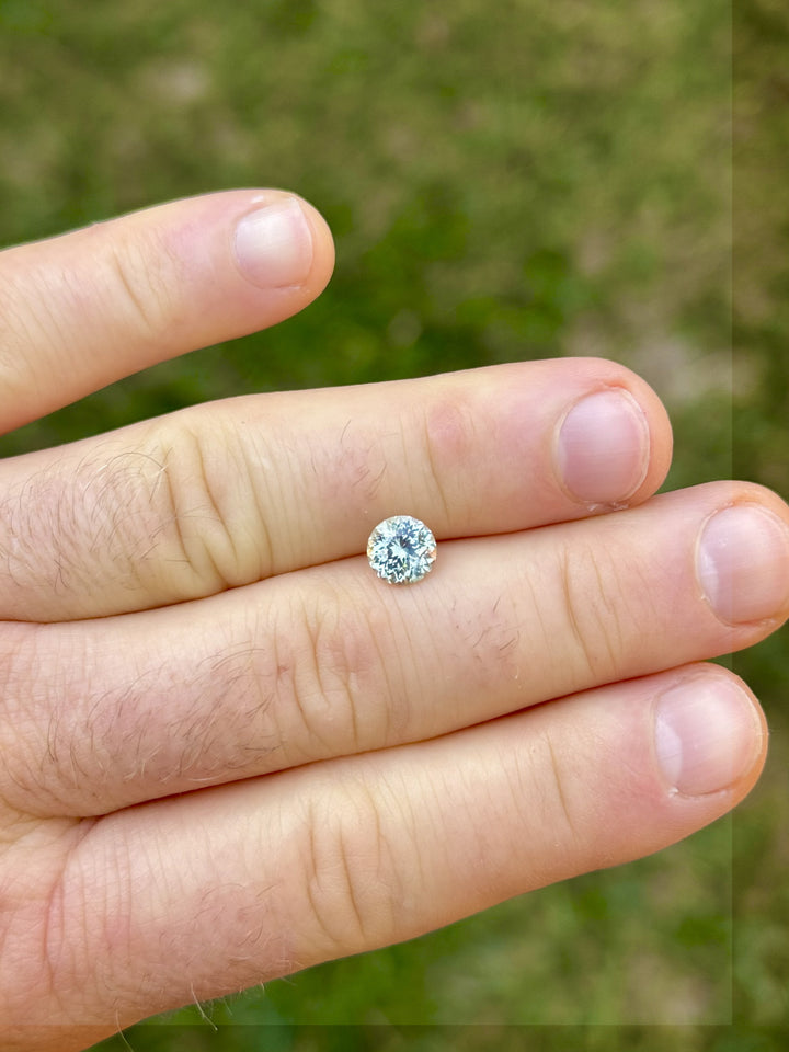 Close-up macro shot of 1.59ct mint green sapphire from Montana with Portuguese cut brilliance