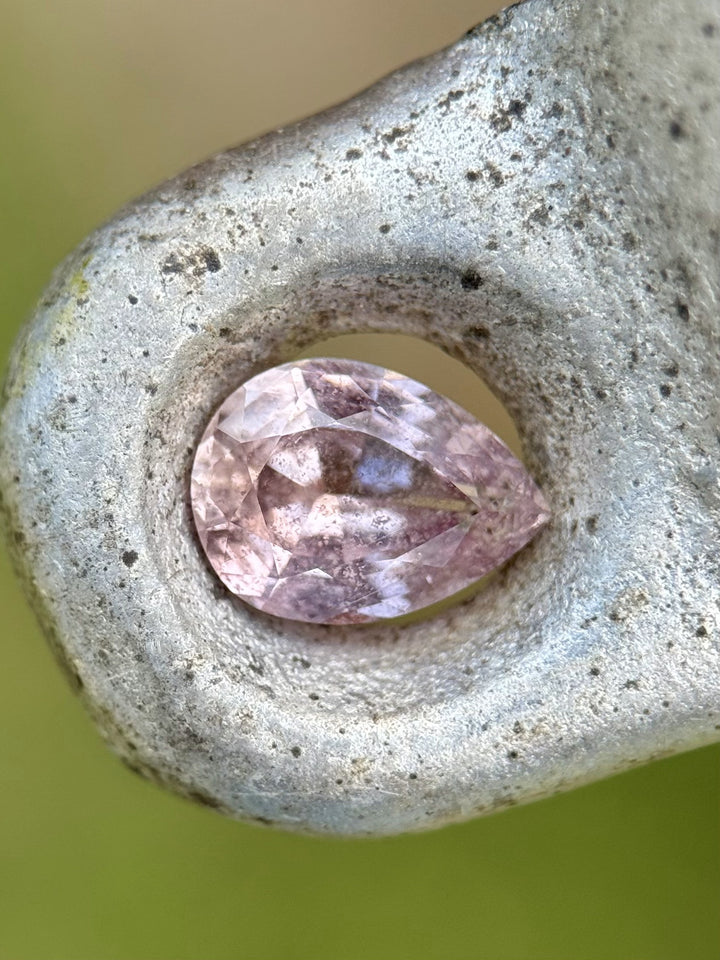 Natural untreated 1.45ct sapphire from Umba River, Tanzania, showing unique champagne and lavender hues with a salt and pepper appearance