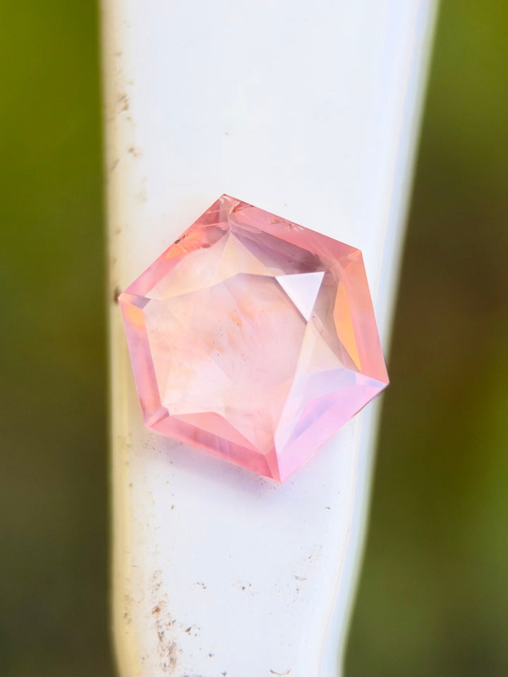 Natural 2.67 carat opalescent padparadscha sapphire from Ratnapura, Sri Lanka, featuring a precision custom hexagon brilliant tablet cut and untreated pink-orange coloration.