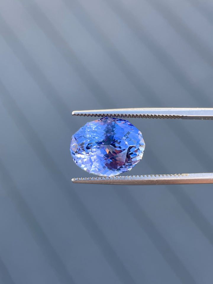 A beautiful 9.31-carat tanzanite gemstone with natural blue and purple hues, sourced from Merelani Hills, Tanzania.
