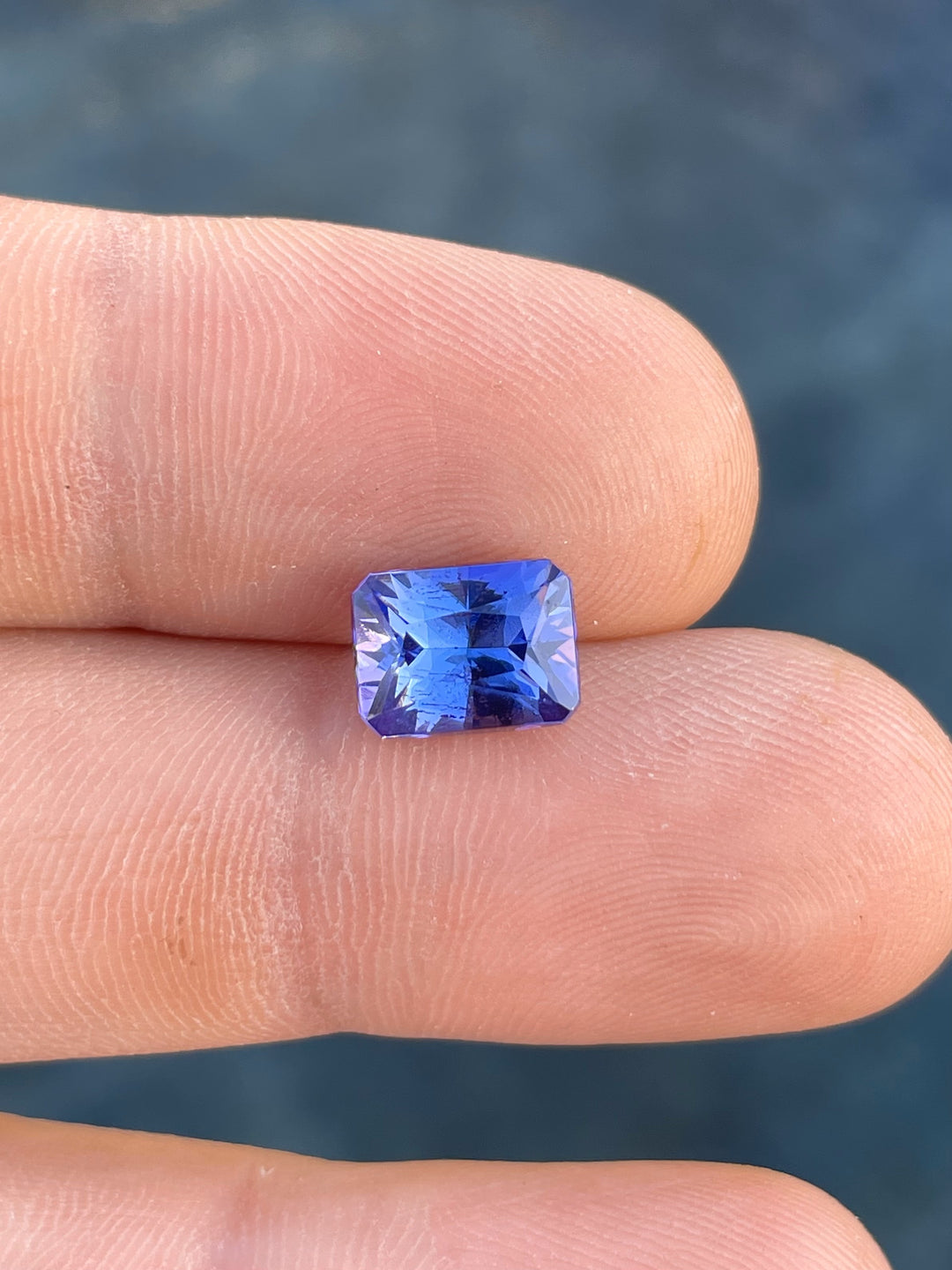 A naturally untreated tanzanite gemstone, 3.57 carats, displaying breathtaking blue and ultra violet tones