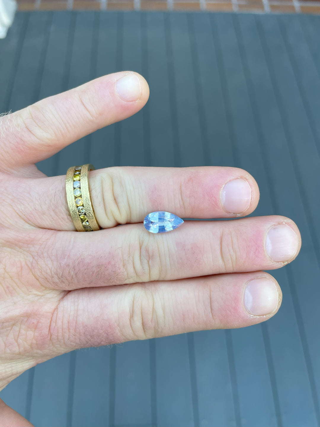 A stunning opalescent blue sapphire weighing 3.53 carats with a mix brilliant pear cut, measuring 12.80 x 6.95 x 4.79 mm, sourced ethically from Sri Lanka.