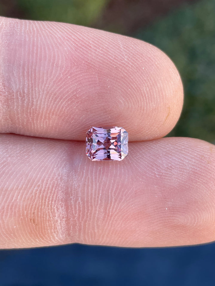 A stunning peach champagne garnet weighing 1.45 carats in a modified octagonal step cut, with dimensions of 6.83mm x 5.53mm x 4.25mm, ethically sourced from Madagascar.